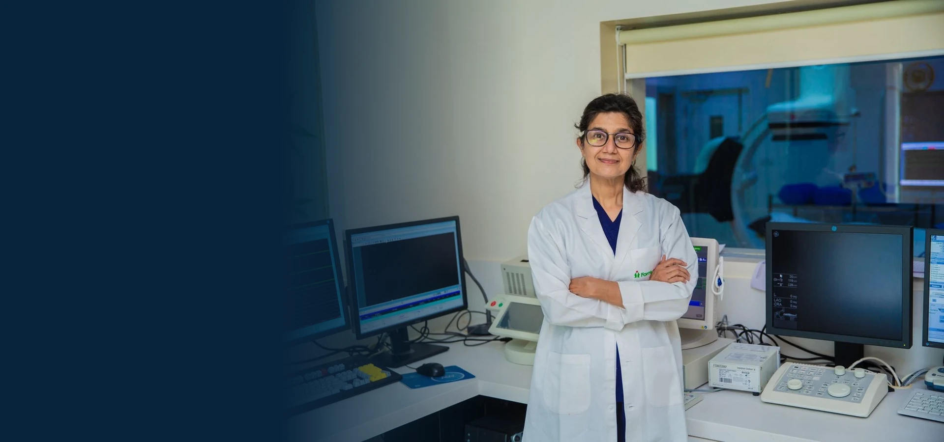 Real healthcare portrait photographed in Delhi with a navy editorial background